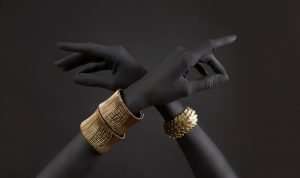 Black woman's hands with gold jewelry